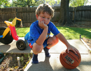 bored boy w basketball